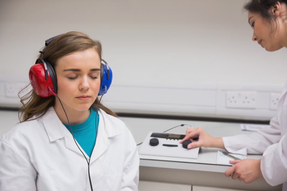 Student doing a hearing test at the university Student doing a hearing test at the university